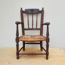 Load image into Gallery viewer, Child&#39;s chair Original rush seat Original stain and patina Dimensions: Height: 22.75 inches, Width: 13.25 inches, Diameter: 12.25 inches
