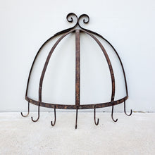 Large iron pot rack Hangs from wall Dimensions: Height: 27 inches, Width at base: 27 inches, Depth: 10 inches